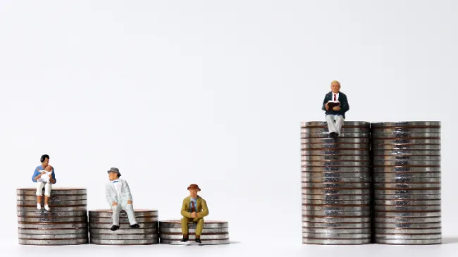 figurines on different coin stacks